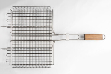 metal grill basket isolated on gray background, top view