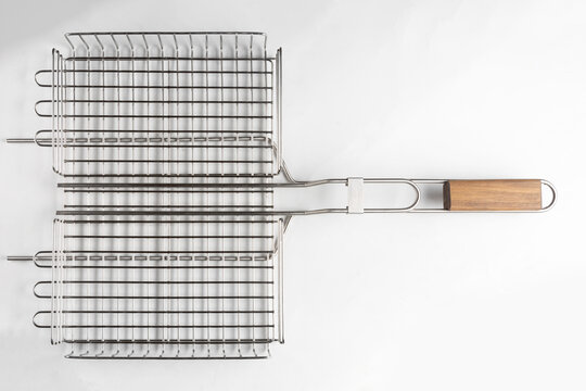 metal grill basket isolated on gray background, top view