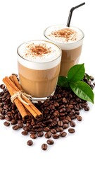 Two lattes with coffee beans and cinnamon