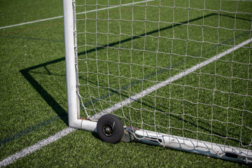 Goal nets on edge of soccer field / football pitch view 2