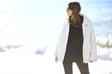 girl in sunglasses beach winter cold vacation freedom mediterranean sea