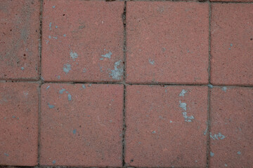 Red old brick wall with textured surface