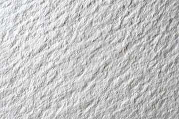 Close-up of textured, light gray stone-like surface