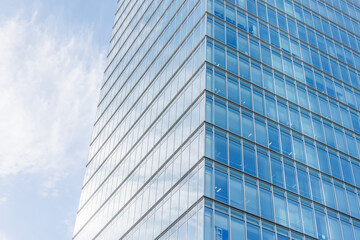 Business office building, Glass windows, High rise skyscraper glass building on blue sky background