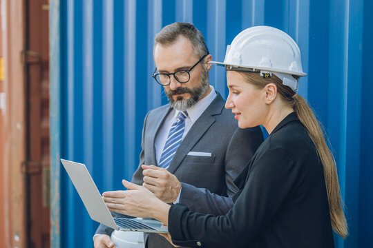 Business manager team working in container yard, Shipping logistics business investor industry people.