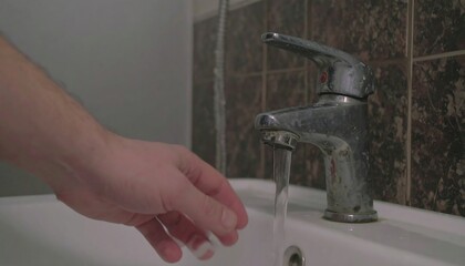 Hand washing under faucet