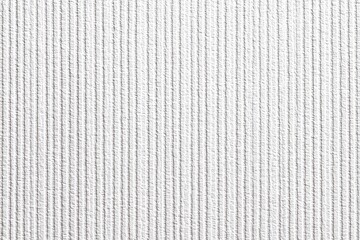 Close-up of a light gray, textured fabric with vertical ribbed lines