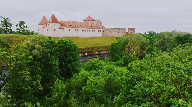 Fortified castle in Latvia with 3.5m walls and Renaissance ducal residence mix