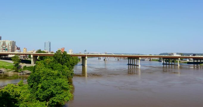 Static video of the Arkansas river in Little Rock, Arkansas. A bridge with traffic can be seen as well as building in the background.