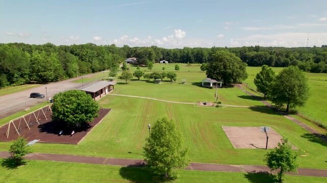 Aerial footage of the Wooster City Park in Wooster Arkansas. Camera flies over the park revealing several park ammenities.