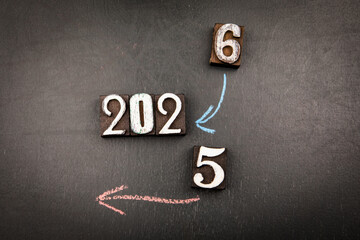 Year change from 2025 to 2026 with chalk arrows