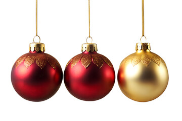 Photo of two red and one gold shiny glitter christmas ornaments hanging isolated on transparent background, festive holiday decoration