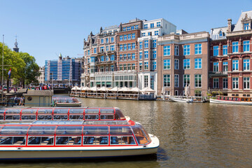 Amsterdam, Netherlands - July 02, 2018: The embankment of the Amstel River in the center of Amsterdam
