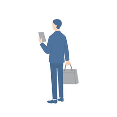 ビジネスバッグを持ってスマホを確認しているビジネスマンの後ろ姿