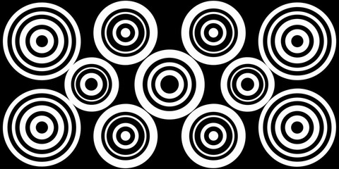 A collection of twelve circular graphic elements, set against a black background. Each element is composed of radiating, concentric, thin, white lines forming various circular and spiral patterns. Som