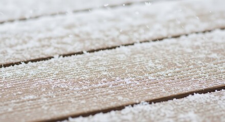 Winter s delicate touch Snowflakes gently resting on weathered wooden planks a peaceful scene evoking the quiet beauty