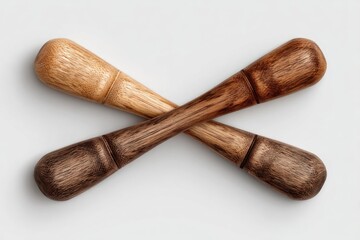 Two crossed wooden spice grinders