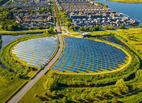Aerial view of modern sustainable neighborhood in Almere, The Netherlands, with solar panel island supporting district city heating