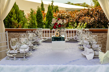 This is an image of a beautifully set table for a special occasion likely a wedding or an anniversary celebration