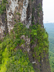 Sao Tome and Principe - Aerial View of Pico Cao Grande. Majestic Volcanic Needle Towering Over Dense Tropical Rainforest.
