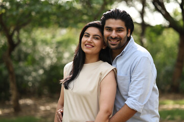 Fototapeta premium Couple Enjoys A Joyful Moment In A Sunny Garden