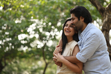 Couple Enjoying A Joyful Moment In A Lush Park