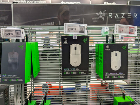 Quebec, Canada, 04 July 2025 : Razer gaming mice displayed on store shelf with illuminated price tags