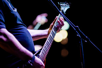 guitarist on stage during concert