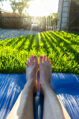 woman doing yoga at sunset outdoors