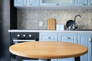 blurred kitchen interior and wooden desk space home background