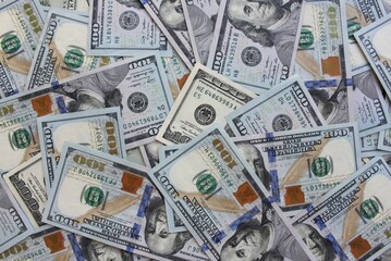 Stacked layers of US hundred dollar bills, American currency