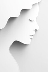 White paper cutout creating minimalist profile of woman
