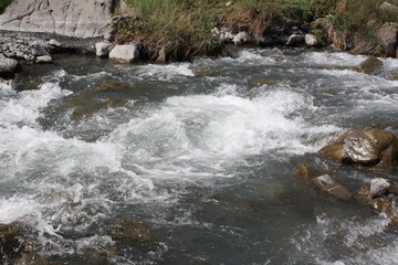 Fototapeta premium water flowing over rocks