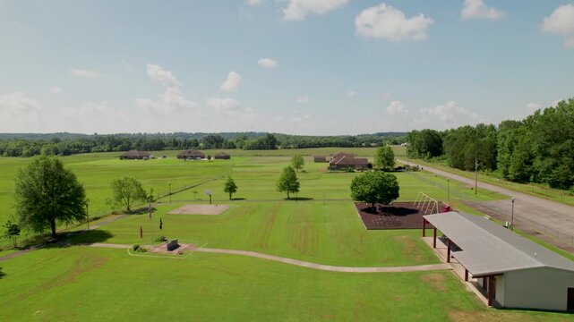 Aerial footage of Wooster City Park in Wooster Arkansas. Camera is heading approximately south passing over the park.