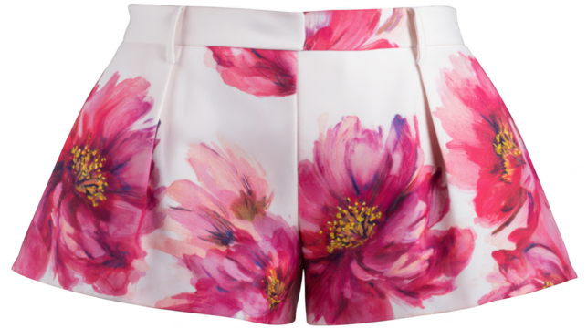 A stylish pair of clean white shorts featuring a delicate and beautiful pink floral pattern perfect for warm summer weather presented in a clear well lit studio setting.