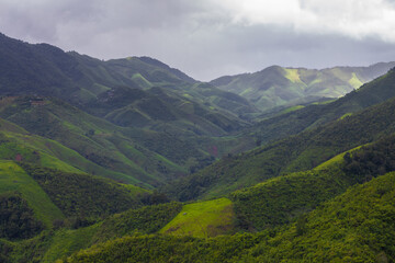 Fototapeta premium Huai Thon Village is a small village near Sapan Village. It has beautiful surrounding mountain scenery, during the rainy season when it is lush and lush with a light mist, located in Bo Kluea, Nan