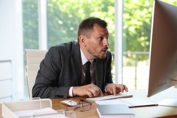 Businessman suffering from panic attack at workplace in office