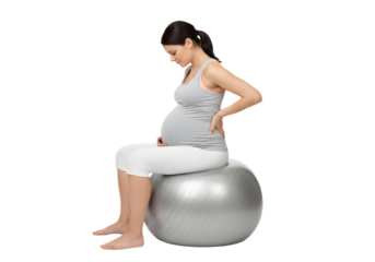 Pregnant woman sitting on a fitness ball indoors on transparent background