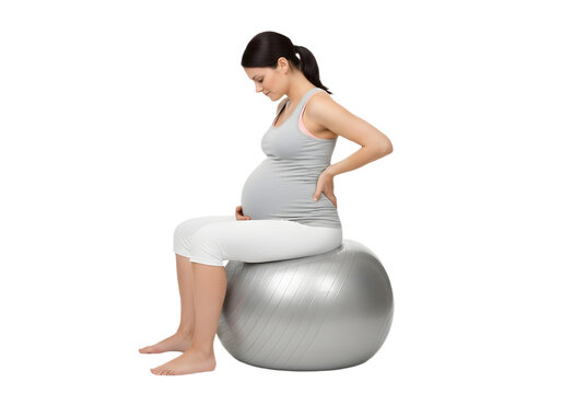 Pregnant woman sitting on a fitness ball indoors on transparent background