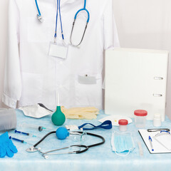 A substantial quantity of medical objects, instruments, tools, supplies, equipment and documents at the place of work of a physician in a doctors office. Concepts associated with healthcare, medicine