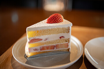 Strawberry short cake on wooden table