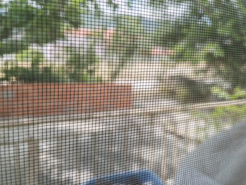 Fly screen mosquito net attached to window frame for insect protection