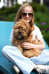 Little Girl in City Park Walking Playing with her Havanese Bichon-type Dog Seasonal Summer
