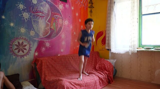 Autistic child showing challenging behavior with his mother at home.