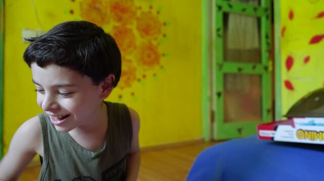 Autistic boy having a meltdown at home while mother tries to calm him