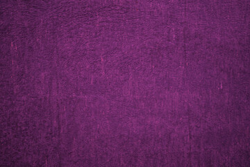Dark purple matte background, embossed textured wall.