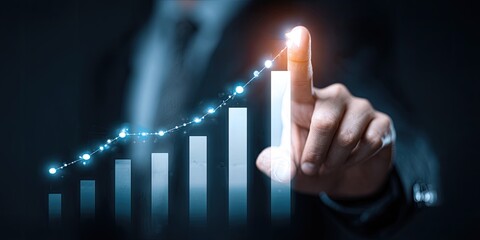 Business growth, hand pointing at rising graph