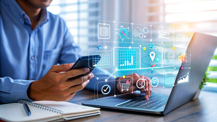 Modern professional using smartphone and laptop for online business, technology, and digital marketing