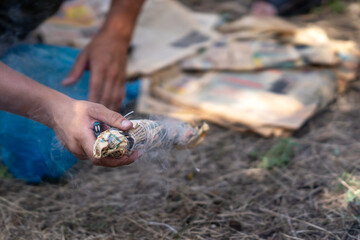 A smoke bomb in his hands