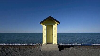 Yellow beach hut on a shore